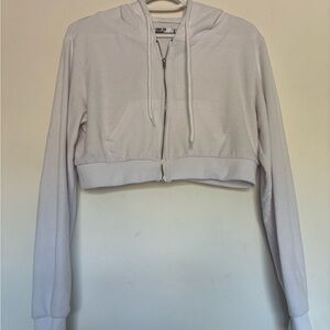 Brand is refuge athletics. Size L. Color is white.